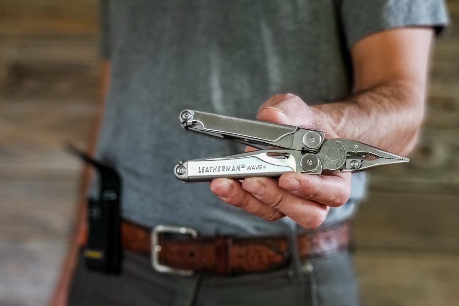 close up of a person holding the leatherman wave+