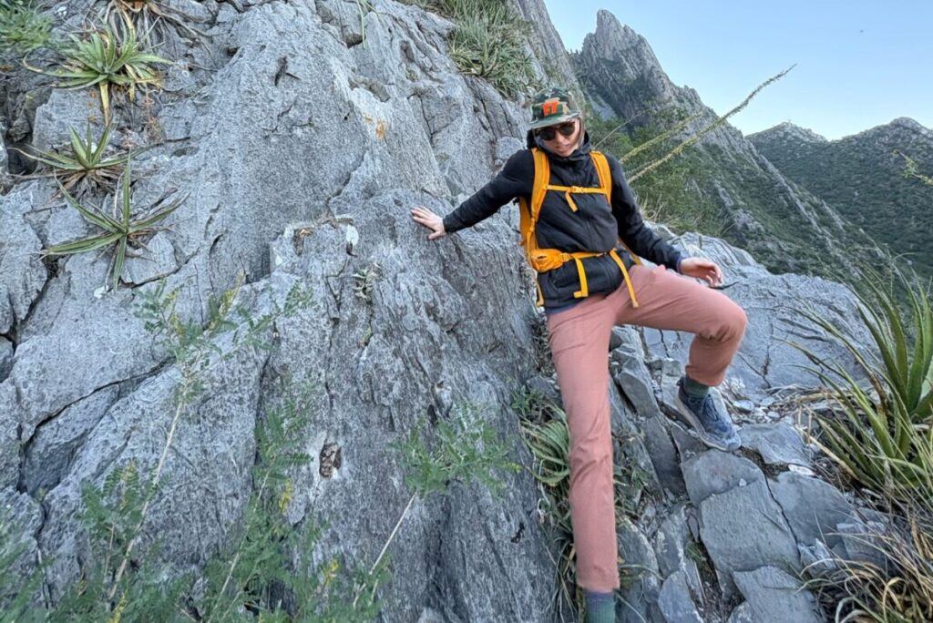 woman down climbing a limestone area
